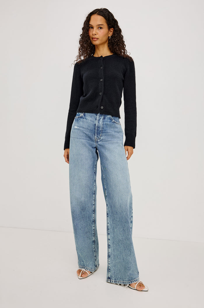 Matilda Cardigan in Wool-Blend Knit WIth Relaxed Slightly Cropped Fit, Crew Neck, Front Buttons, and Ribbed Trim in Black Colorway - Full Body Front View Featured on Model