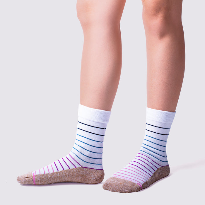 Striped diabetic socks for women, featuring a white cuff and varying blue and pink stripes on a light background.