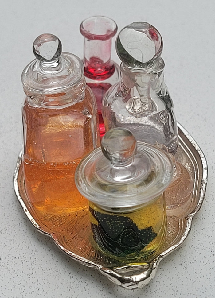 Potions and Frog in Glass Jar on Metal Platter