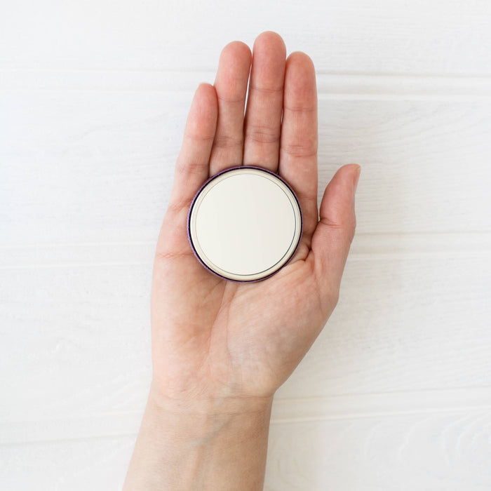 Soli Deo Gloria Pocket Mirror held in hand showing mirror side