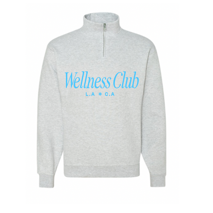 Light gray fleece quarter zip pullover with blue "Wellness Club L.A * C.A" text on the front, named Wellness Club Quarter Zip | Lucky Owl, featuring a stand collar and ribbed cuffs.