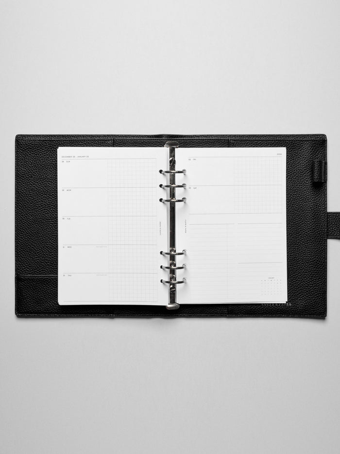 Inserts in use inside a leather planner.