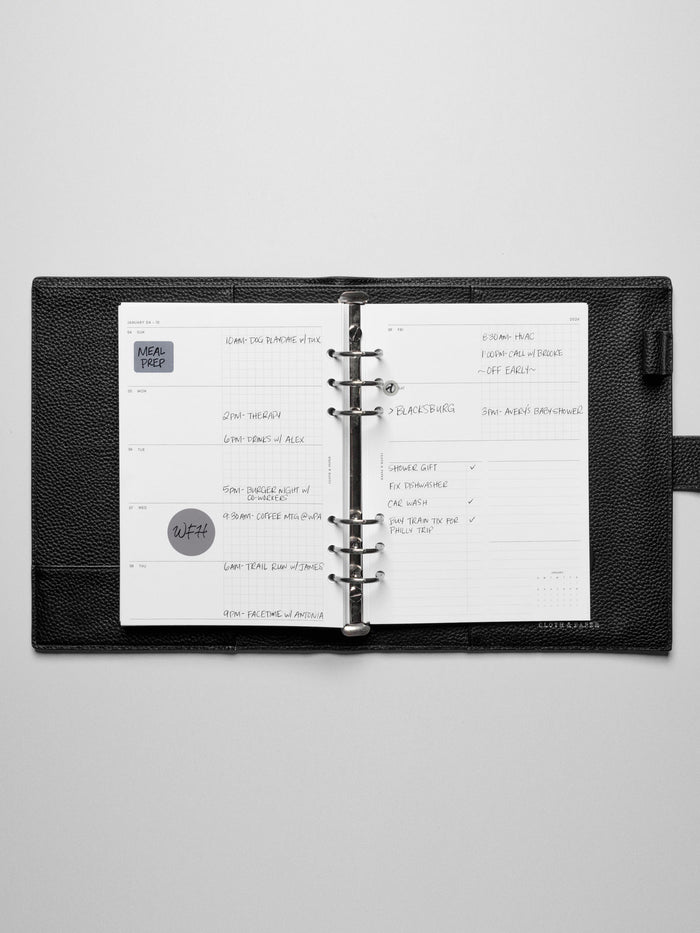 Inserts in use inside a leather planner.