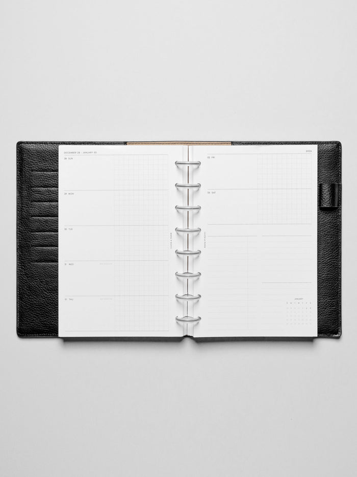 Inserts in use inside a leather planner.