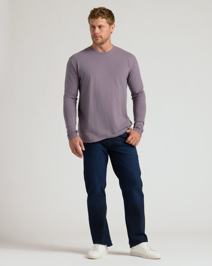 Man in Ashberry Classic Long Sleeve Crew Neck, jeans, sneakers.