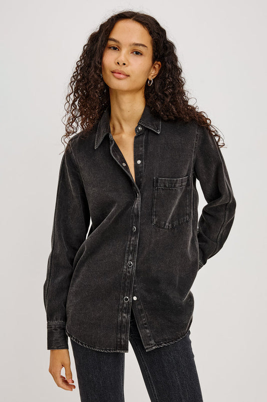 Atticus Shirt in Soft TENCELâ„¢ Denim With Relaxed Fit, Point Collar, Front Button, and Long Sleeves With Flat-Felled Seams and Buttoned Cuffs in Washed Black Colorway - Upper Body Front View Featured on Model