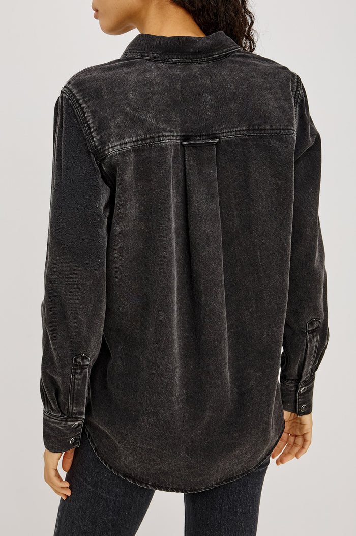 Atticus Shirt in Soft TENCELâ„¢ Denim With Relaxed Fit, Point Collar, Front Button, and Long Sleeves With Flat-Felled Seams and Buttoned Cuffs in Washed Black Colorway - Upper Body Back View Featured on Model