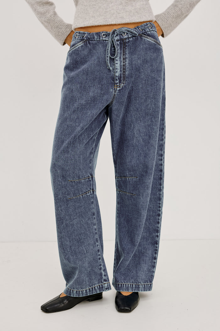 Barry Pant in Cotton Lyocell Denim With Wide Legs That Taper at Hem, Front Zip, Grommet Drawstring Waistband, and Side Slant Pockets in Blue Lagoon Colorway - Lower Body Front View Featured on Model