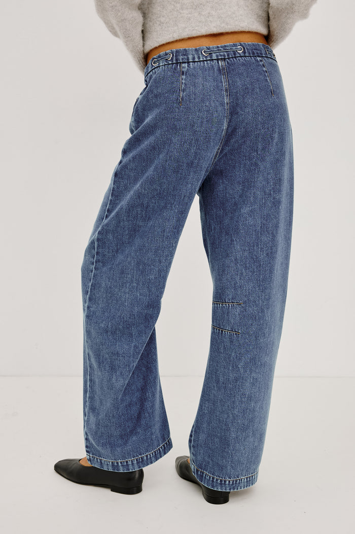 Barry Pant in Cotton Lyocell Denim With Wide Legs That Taper at Hem, Front Zip, Grommet Drawstring Waistband, and Side Slant Pockets in Blue Lagoon Colorway - Lower Body Back View Featured on Model