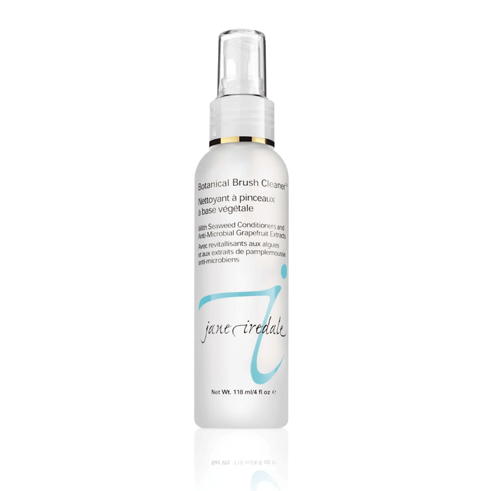 White spray bottle of Botanical Brush Cleaner™ | Jane Iredale with light blue logo and text highlighting seaweed conditioners and grapefruit extract for brush cleansing and skincare maintenance.