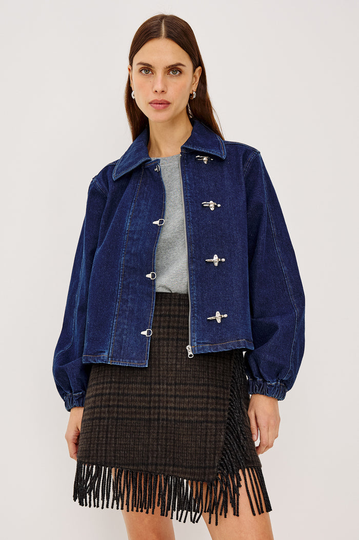 Brooke Jacket in Midweight Denim With Duffel Slightly Cropped Fit, Long Balloon Sleeves, Elastic Cuffs, Back Yoke Pleat, and Front Toggle Closures in Rinse Indigo Colorway - Upper Body Front View Featured on Model