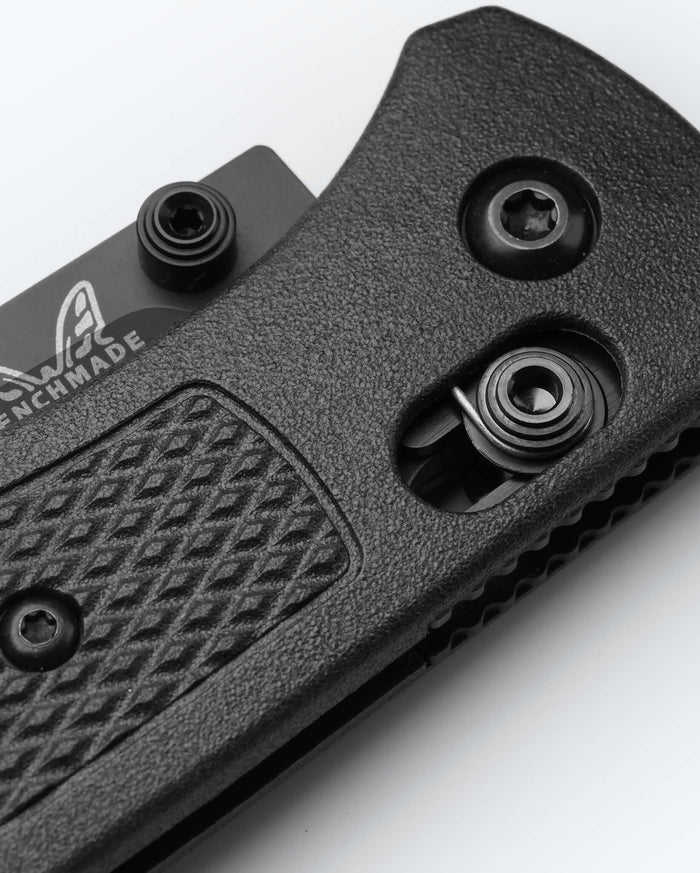 Bugout® CF-Elite® knife close-up detail of carbon fiber handle and hardware | Benchmade Knife Co.