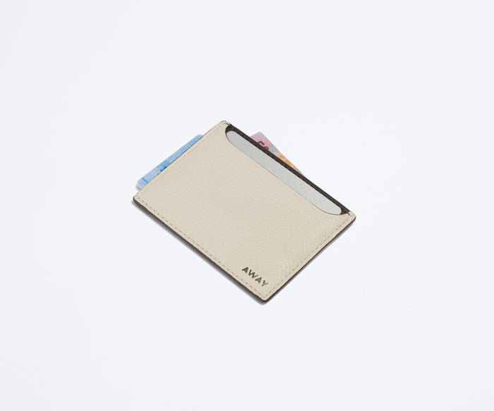 Card case filled with money and credit cards