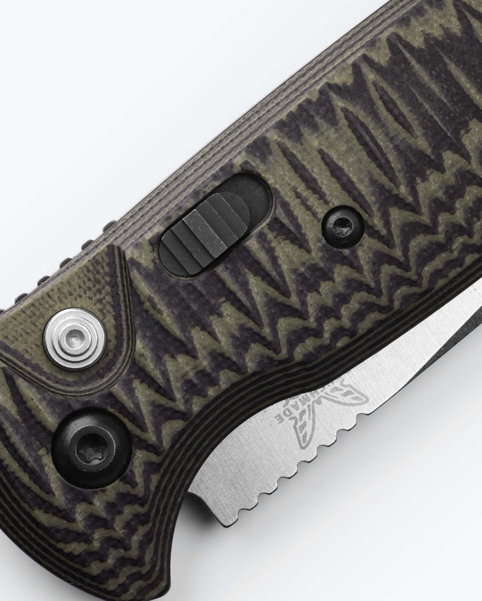 CLA Green & Black G10 knife close-up detail view of actuation button - Benchmade Knife Co.