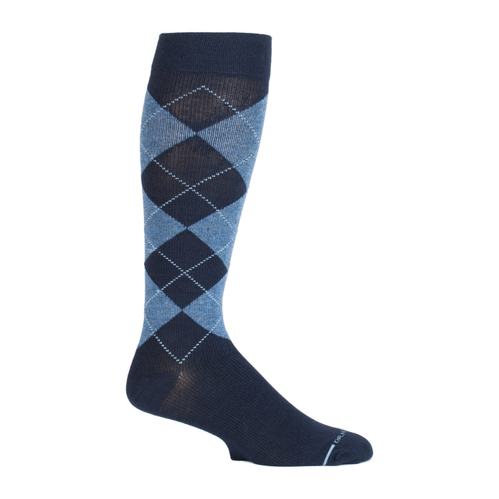 Knee-high compression sock featuring a classic argyle pattern in shades of blue and navy.