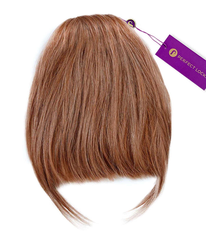 A short, golden brown  Clip-In Bangs hair extension from Perfect Locks with straight bangs and a purple Perfect Locks tag attached.#color_golden-brown-(6)