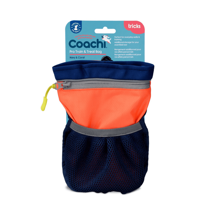 White background with a a Coachi Pro Train and Treat bag in navy and coral with a blue tag attached to the top.