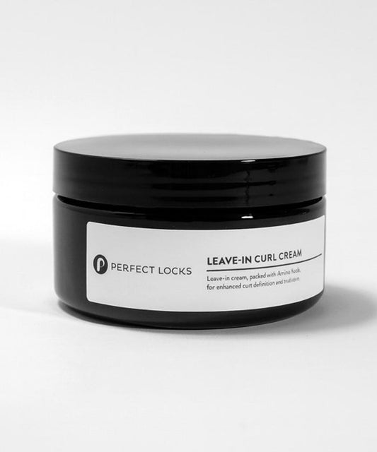 A black jar labeled Perfect Locks Leave-In Curl Cream sits against a white background, featuring amino acids for curl definition.