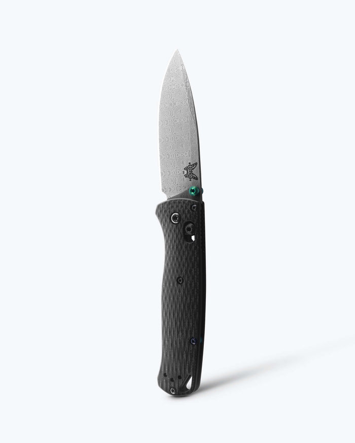 Damascus Steel Custom BUGOUT® knife shown vertically tip up - Carbon Fiber | Benchmade Knife Co.