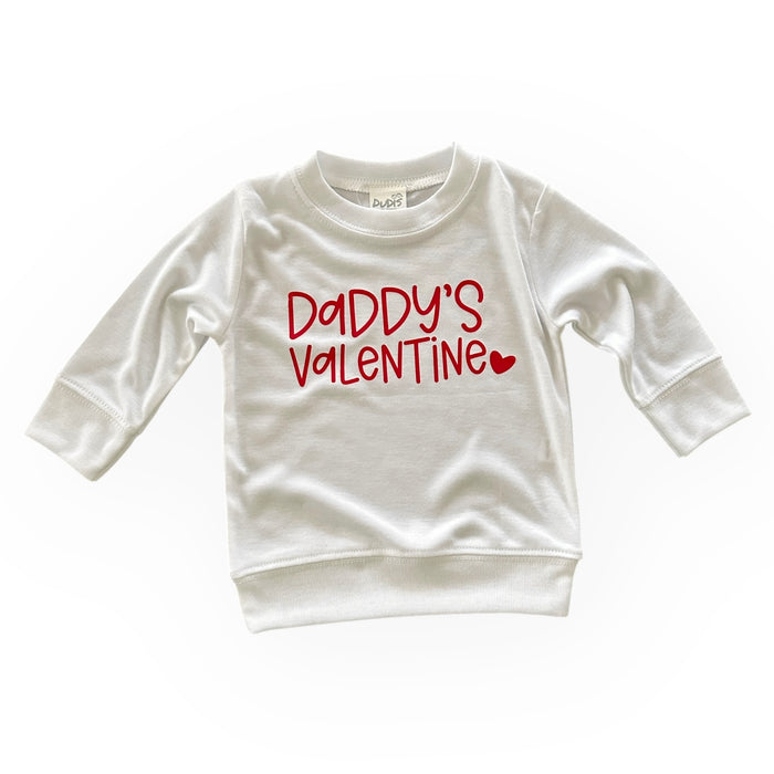 A soft, white pullover with the phrase "Daddy's Valentine" in playful red lettering. Cozy and stylish for Valentine's Day celebrations.