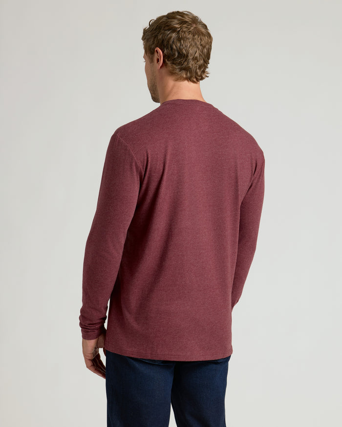 Back view of man in Dark Heather Clovewood Classic Long Sleeve Crew Neck.