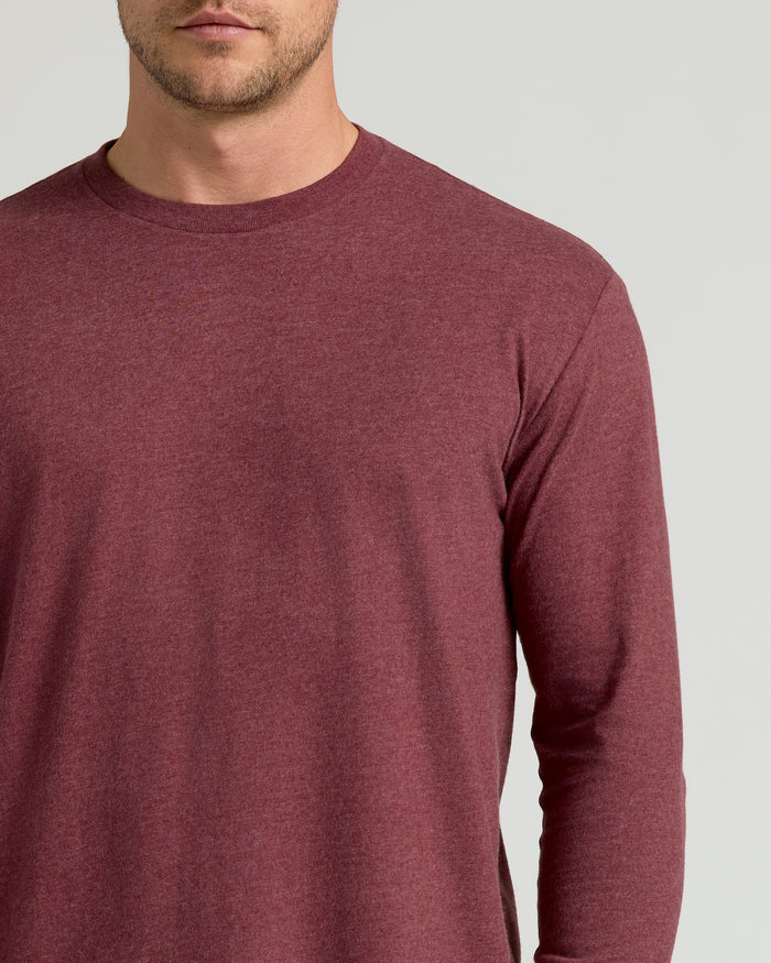 Man wearing Dark Heather Clovewood Classic Long Sleeve Crew Neck.