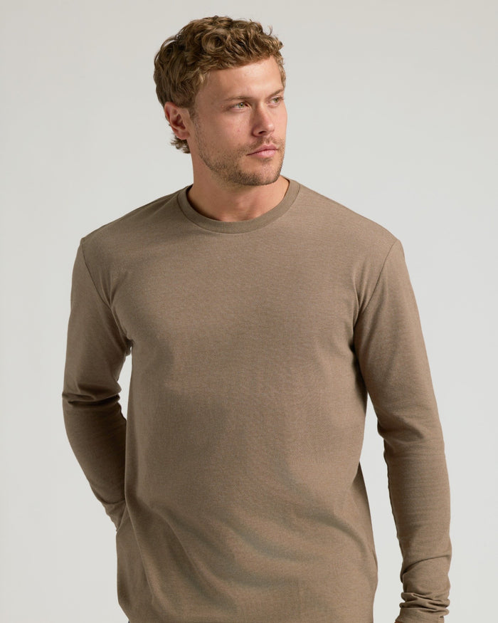 Young man in Dark Heather Sagewood Classic Long Sleeve Crew Neck.