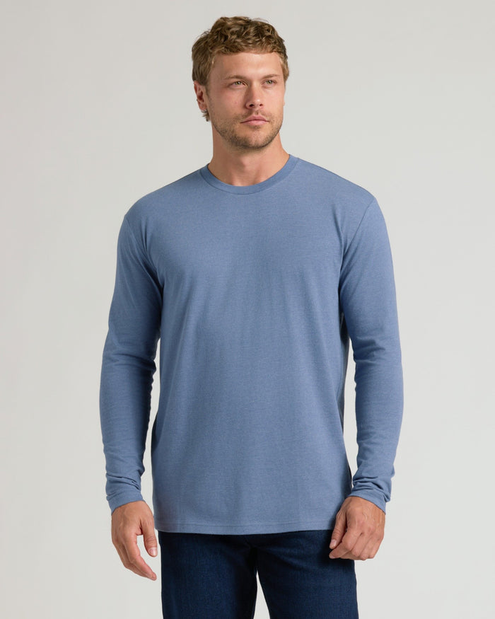 Man wearing Dark Heather Vintage Navy Classic Long Sleeve Crew Neck.