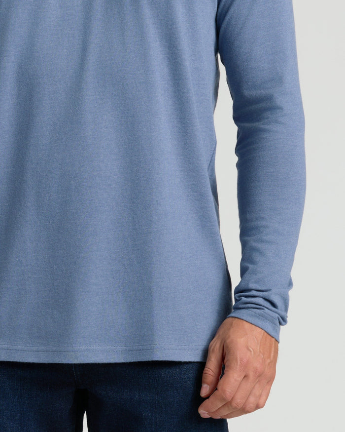 Person wearing Dark Heather Vintage Navy Classic Long Sleeve Crew Neck.