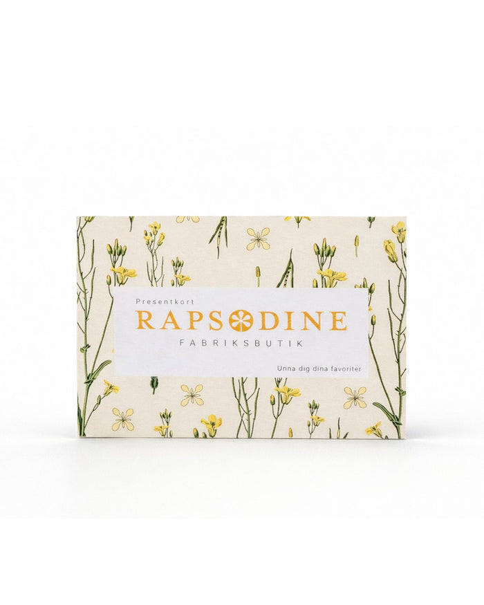 Presentkort från Rapsodine Fabriksbutik med mönster och gula rapsblommor i naturlig design