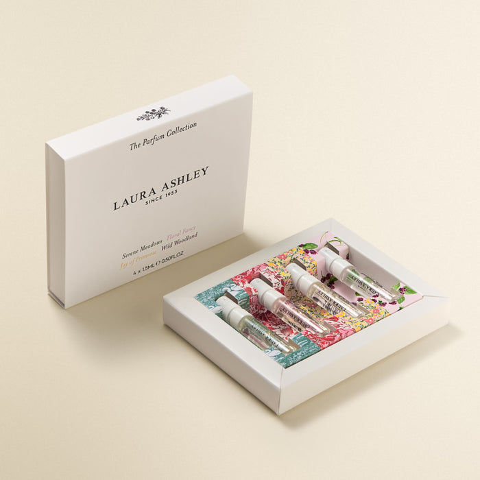 Laura Ashley perfume collection in box on a beige background