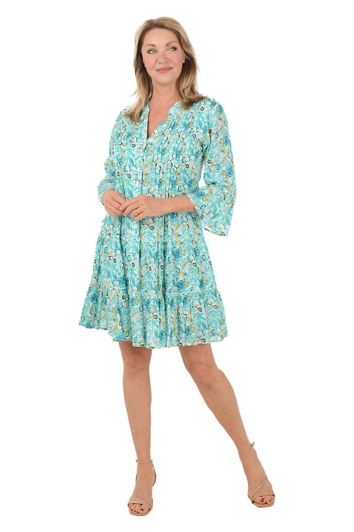 Woman wearing a floral dress on a white background