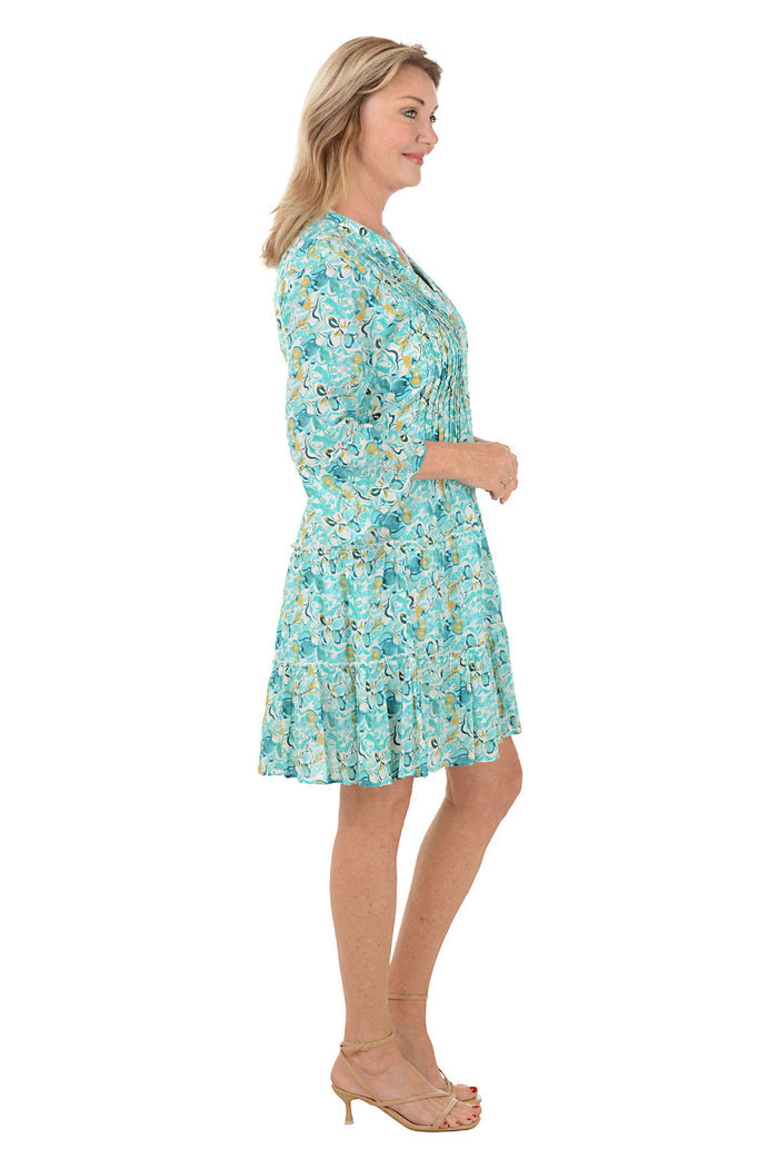 Woman wearing a floral dress on a white background