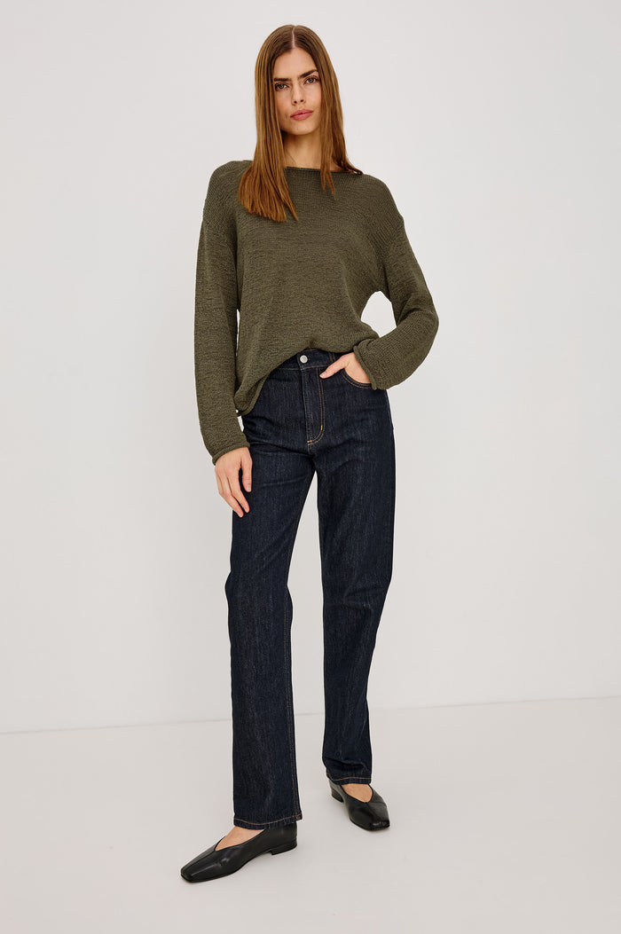 Evangeline Sweater in Luxe Linen Blend With Open Weave, Boat Neck, Relaxed Dropped Shoulders, and Long Sleeves in Olive Colorway - Full Body Front View Featured on Model