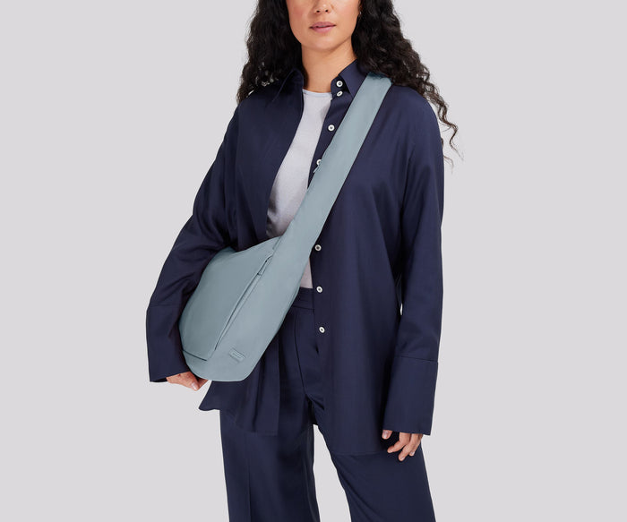 Person wearing the Featherlight Crossbody
// Model is 5’7”