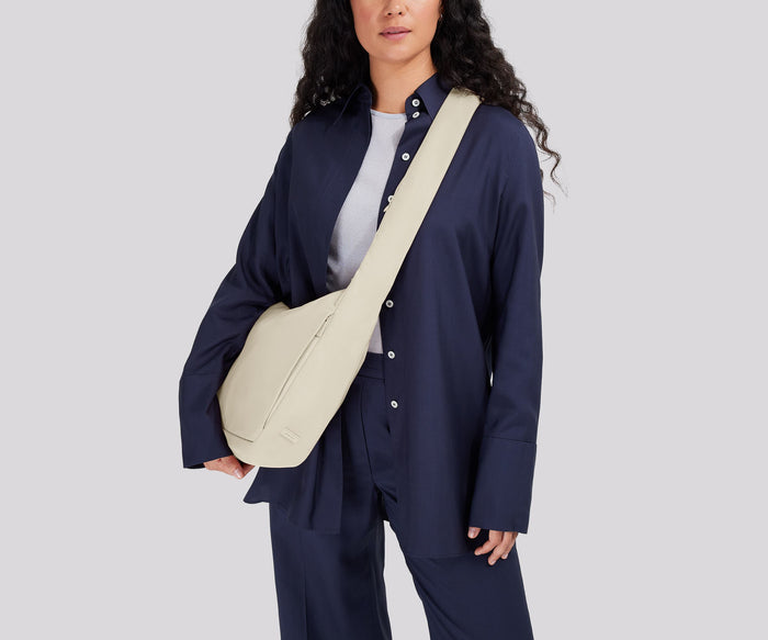 Person wearing the Featherlight Crossbody
// Model is 5’7”