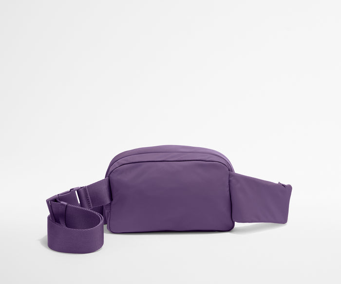 Video of a person packing and wearing the Featherlight Sling Bag
