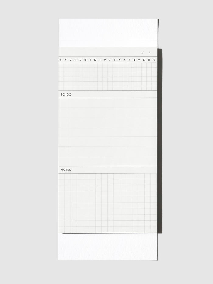 Graph Pad Sticky Note, Cloth and Paper. Sticky note on its backing displayed on a neutral background.