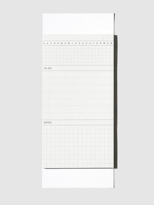 Graph Pad Sticky Note, Cloth and Paper. Sticky note on its backing displayed on a neutral background.
