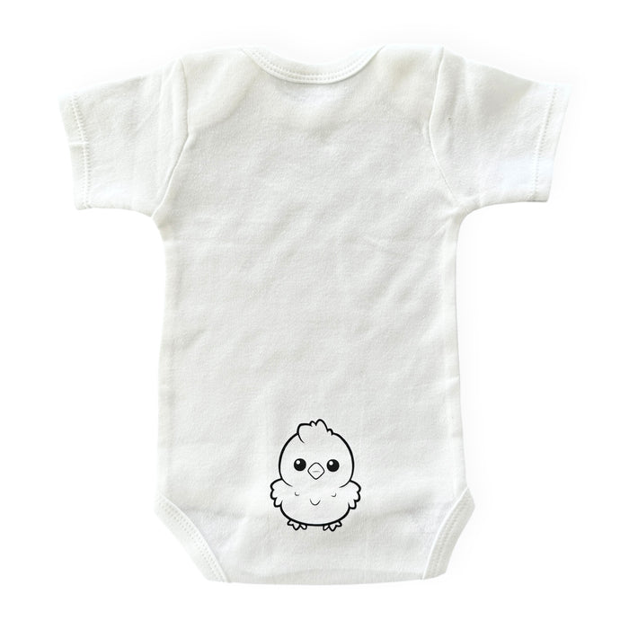 Back view of a white baby bodysuit with a baby chick print – ideal for surprise pregnancy reveals and baby shower gifts.