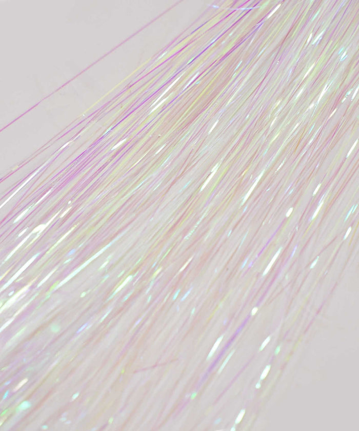 Close-up of Perfect Locks’ Perfect Hair Tinsel in unicorn color—thin, iridescent strands shimmer in pink, yellow, and green hues.#color_unicorn