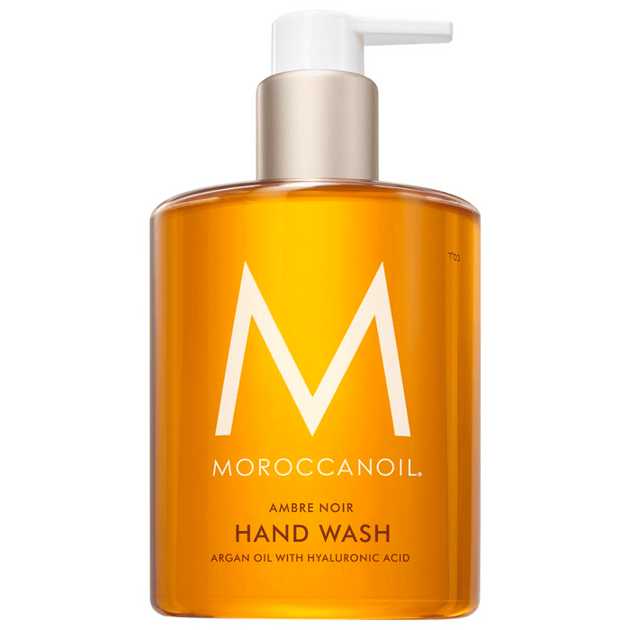 Hand Wash | Moroccanoil in a clear amber pump bottle featuring argan oil and hyaluronic acid for gentle skincare and body care, promoting hydration and wellness.
