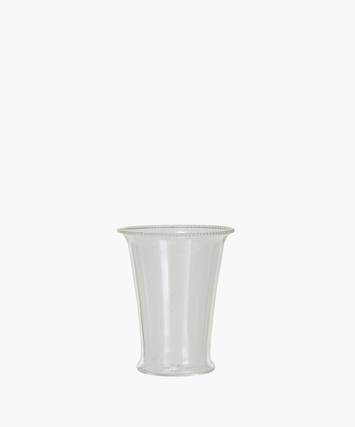 A clear, cylindrical drinking glass with a slightly flared rim. The simple design and transparent material create an elegant and minimalist appearance. | SW Home