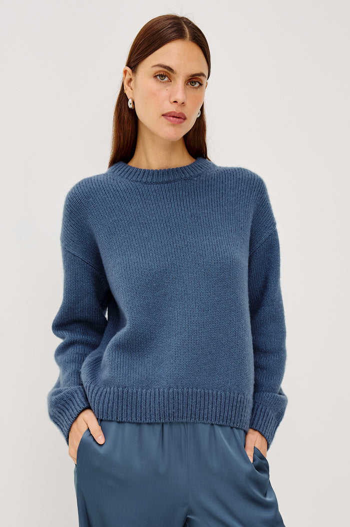 Helly Sweater in Wool-Cashmere Blend With Crew Neckline, Relaxed Boxy Slightly Cropped Fit, Long Sleeves, and Ribbed Trim in Atlantic Colorway - Upper Body Front View Featured on Model