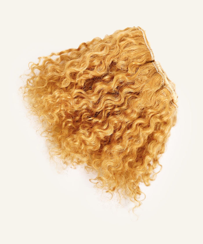 A Perfect Locks Kinky Curly Clip-In Bun in Chocolate Brown  displayed on a light background.#color_honey-blonde-(27)