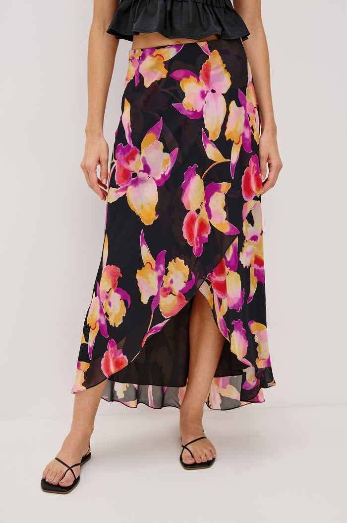 Lenora Cross Front Skirt, High-Low Midi Length, Hidden Elastic Waistband, Lined, in Dusk Orchid Colorway. Front View Shown on Model.