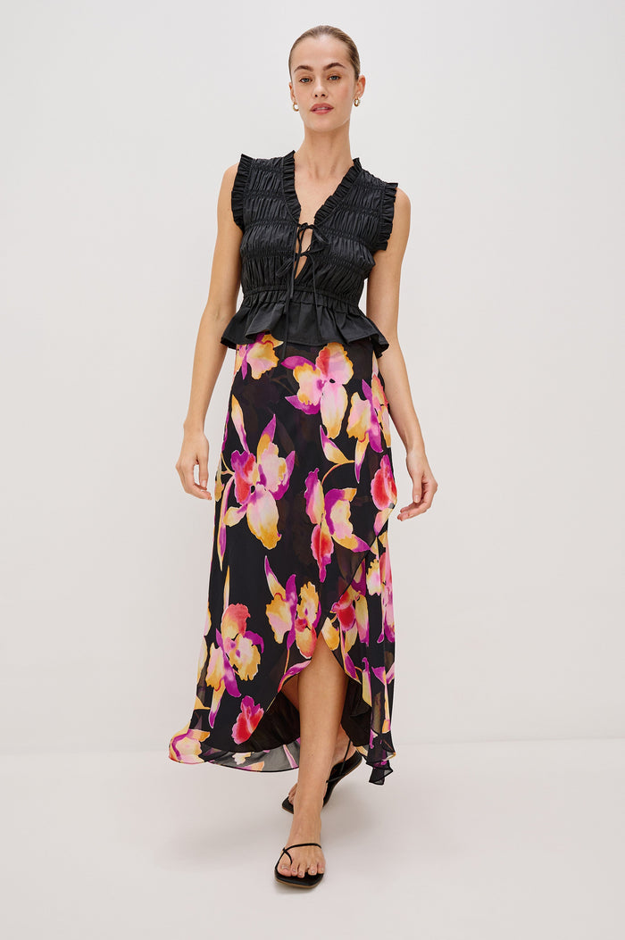 Lenora Cross Front Skirt, High-Low Midi Length, Hidden Elastic Waistband, Lined, in Dusk Orchid Colorway. Full Body Front View Shown on Model.