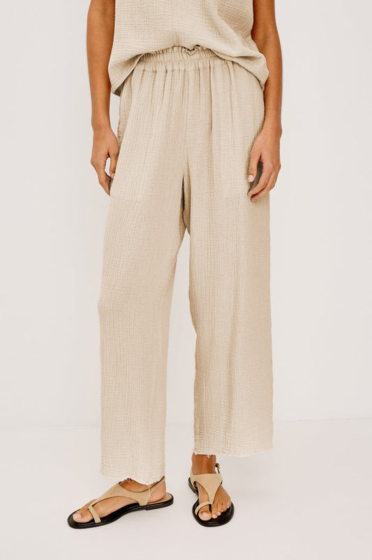 Leon Crop Pant with a Smocked Waistband and Two Front Seam Pockets in Light Brown Heather Flax Colorway - Lower Body Front View Featured on Model