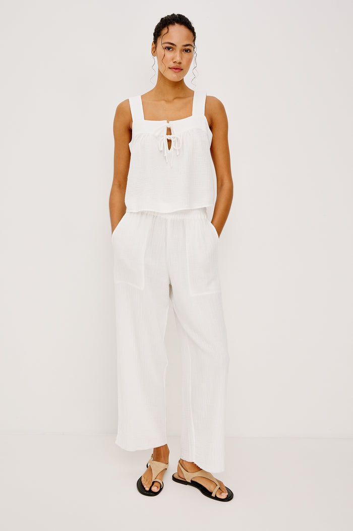 The Leon is a cropped pull-on style crafted from super soft airy double gauze cotton. With a wide-straight leg fit complete with side slits at the outer openings and a smocked waistband this pant puts comfort first.