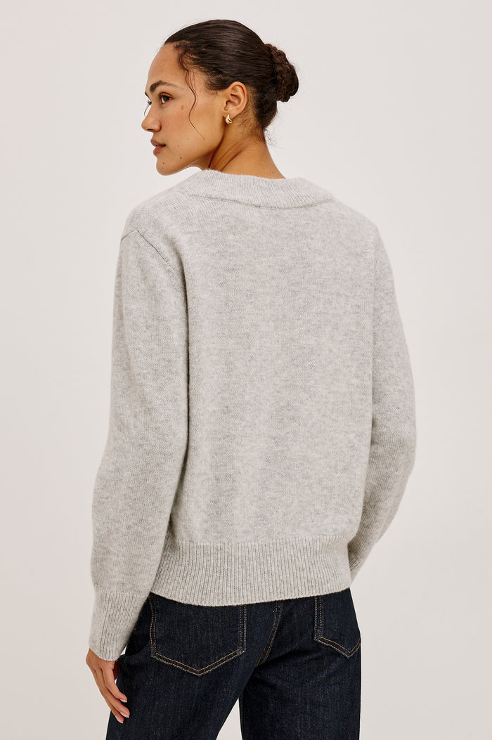 Lidya Sweater in Wool-Cashmere Knit Blend With V-Neckline, Loose Relaxed Fit, Long Sleeves, and Ribbed Trim in Heather Grey Colorway - Upper Body Back View Featured on Model